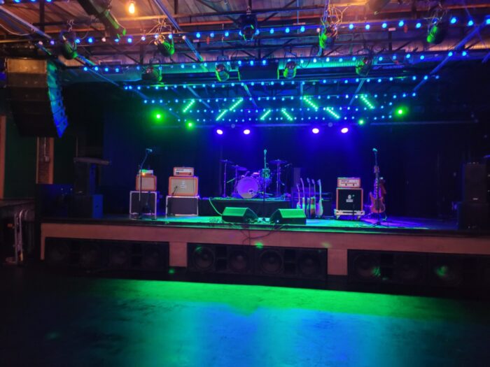 empty stage at Saturn under colorful lights