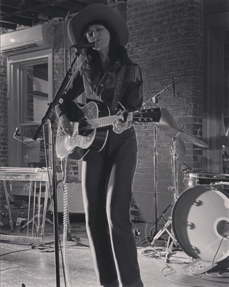 Nikki Lane on stage in black and white