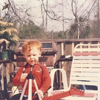 album art of Justin Cross as a child with a guitar and mic