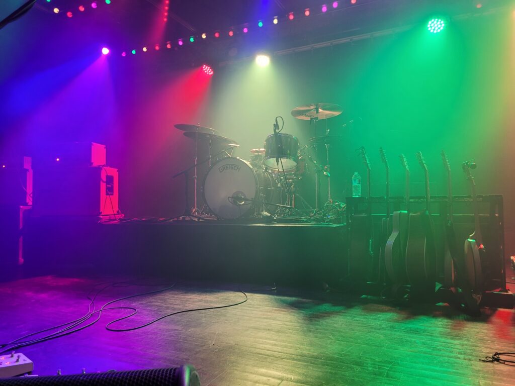 the stage at Saturn in Birmingham in colorful lights