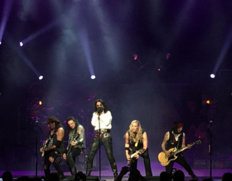Alice Cooper on stage with band
