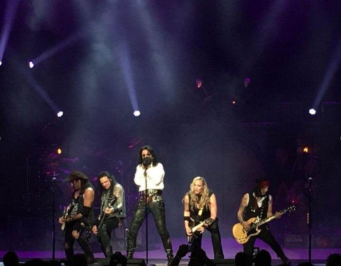Alice Cooper on stage with band